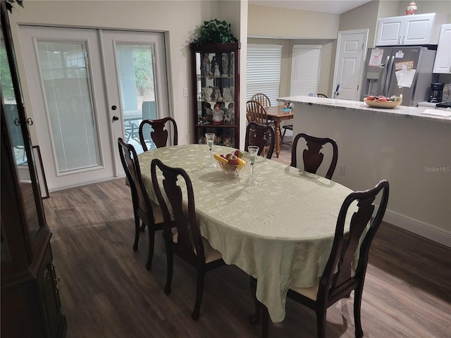 dining room with dark wood finished floors and baseboards