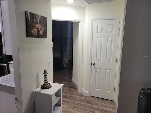 hall with wood finished floors