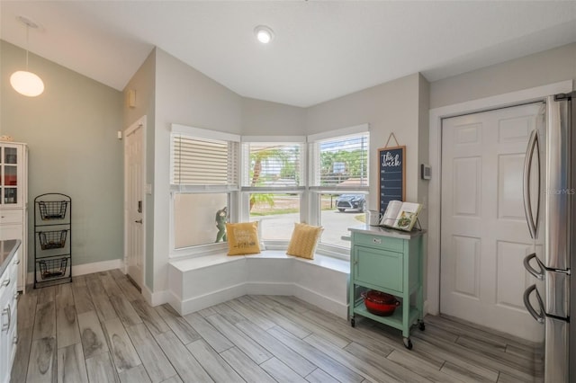 12401 Blue Heron Way, Leesburg, FL 34788 - entryway with lofted ceiling, light wood-style flooring, and baseboards