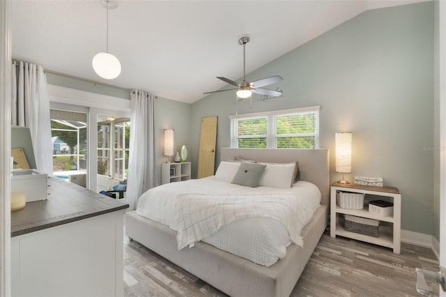 12401 Blue Heron Way, Leesburg, FL 34788 - bedroom featuring light wood-type flooring, baseboards, access to exterior, a ceiling fan, and high vaulted ceiling