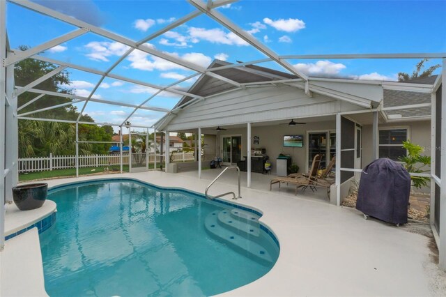 12401 Blue Heron Way, Leesburg, FL 34788 - view of pool featuring ceiling fan, area for grilling, a patio area, and glass enclosure