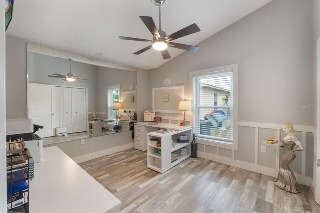 12401 Blue Heron Way, Leesburg, FL 34788 - kitchen featuring open shelves, ceiling fan, light wood-style flooring, light countertops, and a wainscoted wall