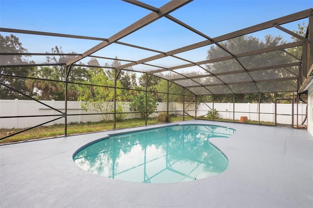 2304 Clementine Trl, Clermont, FL 34714 - view of swimming pool with a fenced backyard, glass enclosure, and a patio area