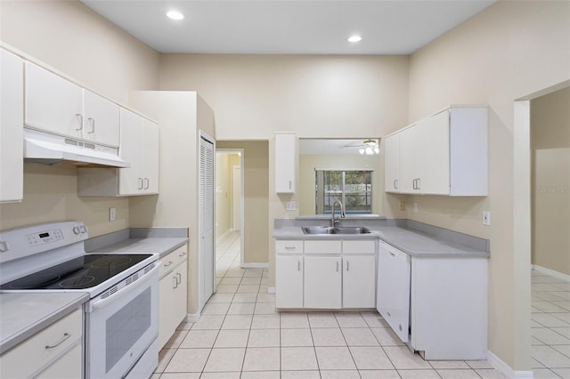 2304 Clementine Trl, Clermont, FL 34714 - kitchen with white appliances, under cabinet range hood, light countertops, and recessed lighting