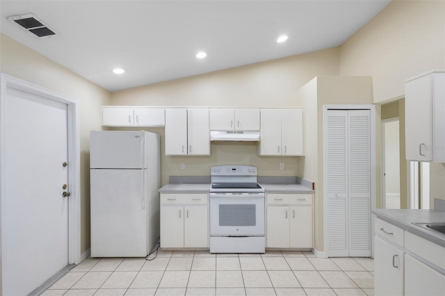 2304 Clementine Trl, Clermont, FL 34714 - kitchen featuring white appliances, under cabinet range hood, white cabinets, lofted ceiling, and light countertops