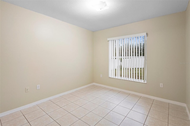 2304 Clementine Trl, Clermont, FL 34714 - spare room featuring light tile patterned floors and baseboards