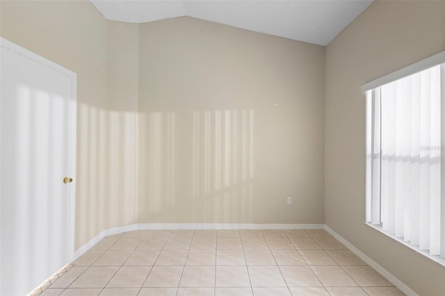 2304 Clementine Trl, Clermont, FL 34714 - spare room featuring lofted ceiling and light tile patterned flooring