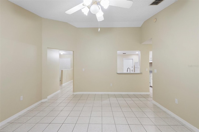 2304 Clementine Trl, Clermont, FL 34714 - empty room with ceiling fan, high vaulted ceiling, and light tile patterned floors