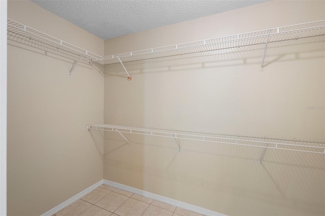 2304 Clementine Trl, Clermont, FL 34714 - spacious closet with light tile patterned floors