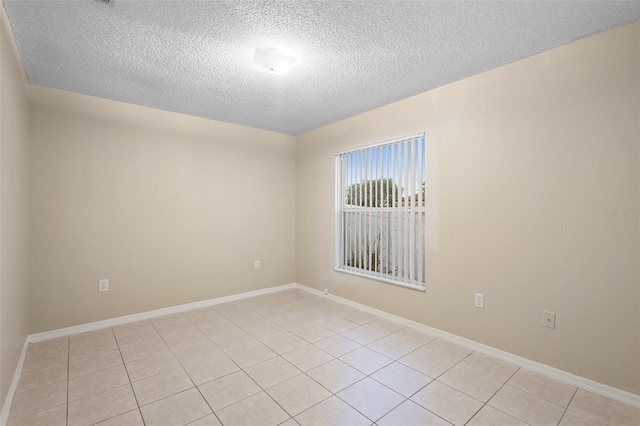 2304 Clementine Trl, Clermont, FL 34714 - empty room with a textured ceiling and light tile patterned flooring