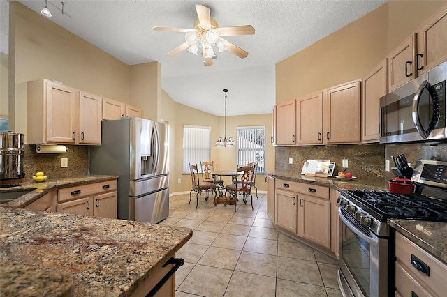 2096 Callaway Dr, The Villages, FL 32162 - kitchen featuring stainless steel appliances, light brown cabinets, vaulted ceiling, ceiling fan, and light tile patterned floors