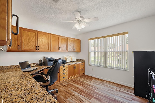 2096 Callaway Dr, The Villages, FL 32162 - office with a ceiling fan, light wood-style floors, a textured ceiling, and baseboards