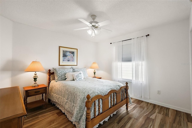 2096 Callaway Dr, The Villages, FL 32162 - bedroom featuring wood finished floors, baseboards, a textured ceiling, and ceiling fan