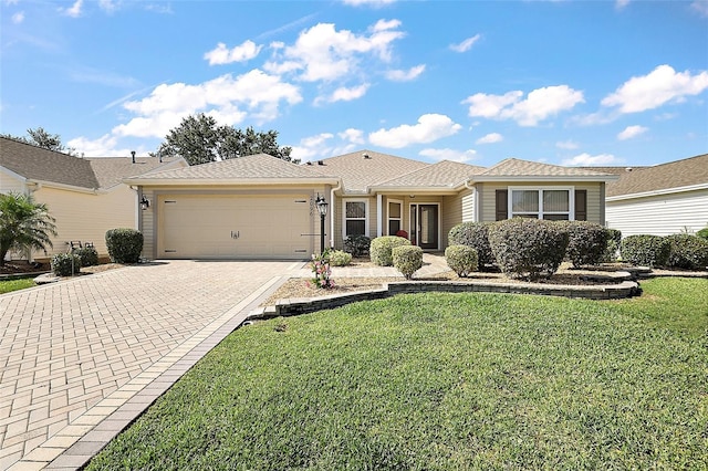 2096 Callaway Dr, The Villages, FL 32162 - ranch-style house featuring an attached garage, driveway, and a front yard
