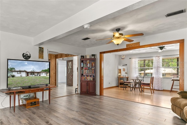 800 Jefferis Ct, Eustis, FL 32726 - living room with ceiling fan and wood finished floors