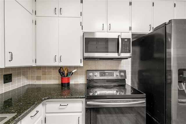 800 Jefferis Ct, Eustis, FL 32726 - kitchen with appliances with stainless steel finishes, white cabinetry, and decorative backsplash