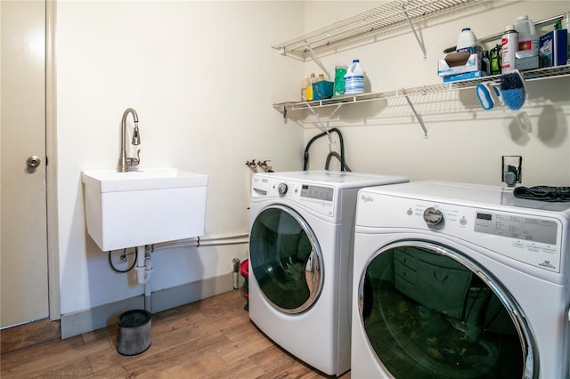 800 Jefferis Ct, Eustis, FL 32726 - clothes washing area with washer and clothes dryer and light wood-style floors