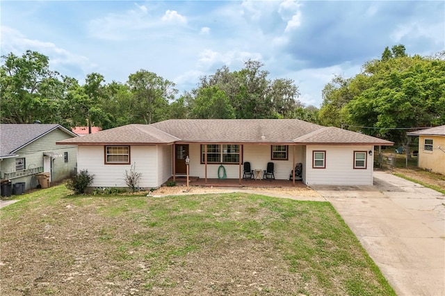 800 Jefferis Ct, Eustis, FL 32726 - ranch-style home featuring a porch, concrete driveway, a front lawn, and a shingled roof