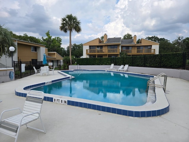 1051 S Highland St Unit 4-E, Mount Dora, FL 32757 - community pool with fence and a patio area