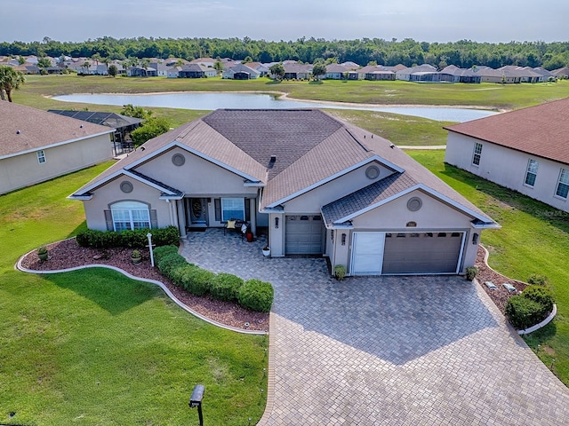 aerial perspective of suburban area with a nearby body of water