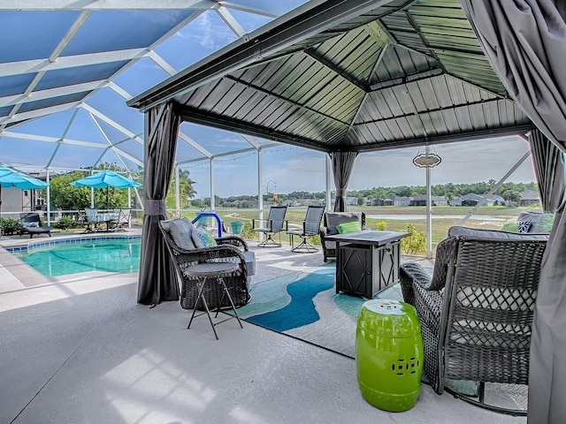outdoor pool with a patio area, a lanai, a gazebo, and outdoor lounge area