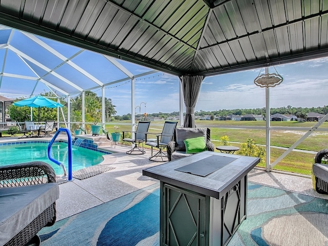swimming pool featuring a patio area and a lanai