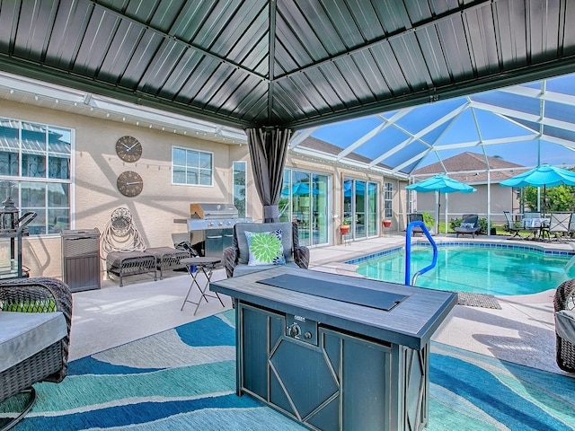 outdoor pool featuring a patio, a lanai, and grilling area