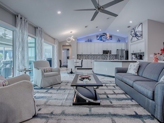 living area featuring ceiling fan, arched walkways, recessed lighting, and high vaulted ceiling
