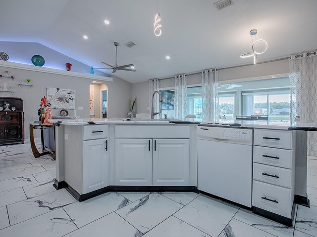 kitchen featuring dishwasher, light marble finish floors, a sink, ceiling fan, and lofted ceiling
