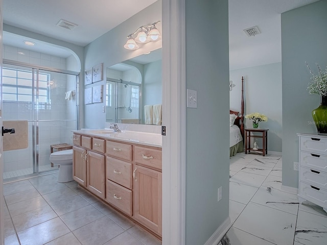 bathroom featuring ensuite bathroom, a stall shower, vanity, and healthy amount of natural light