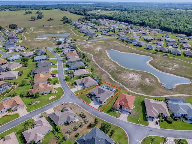 aerial perspective of suburban area featuring a large body of water and property parcel outlined