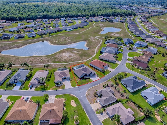 aerial view of residential area with a nearby body of water