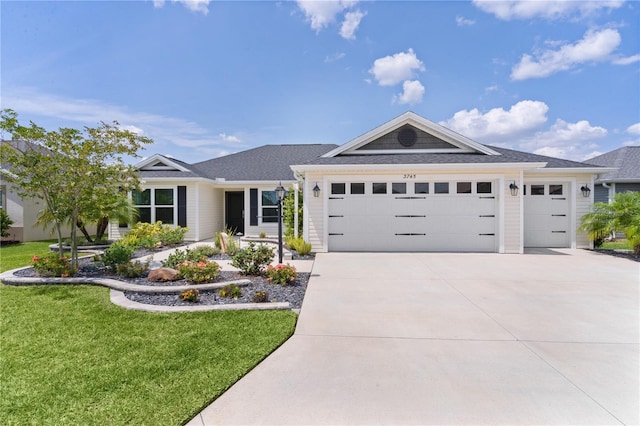 3745 Causey Ct, The Villages, FL 32163 - ranch-style house featuring a garage, driveway, a front yard, and roof with shingles