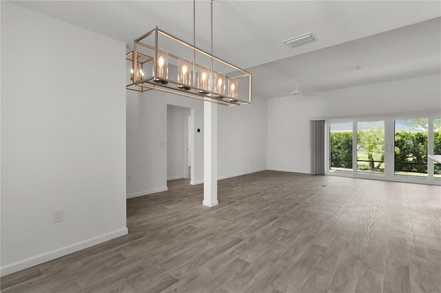 3745 Causey Ct, The Villages, FL 32163 - unfurnished dining area with wood finished floors, ceiling fan, and baseboards