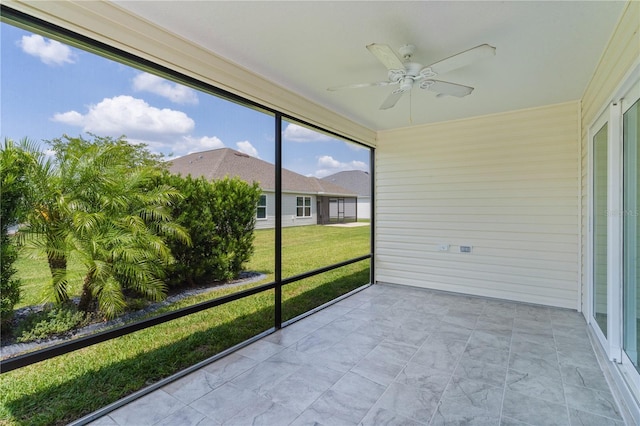 3745 Causey Ct, The Villages, FL 32163 - unfurnished sunroom with a ceiling fan