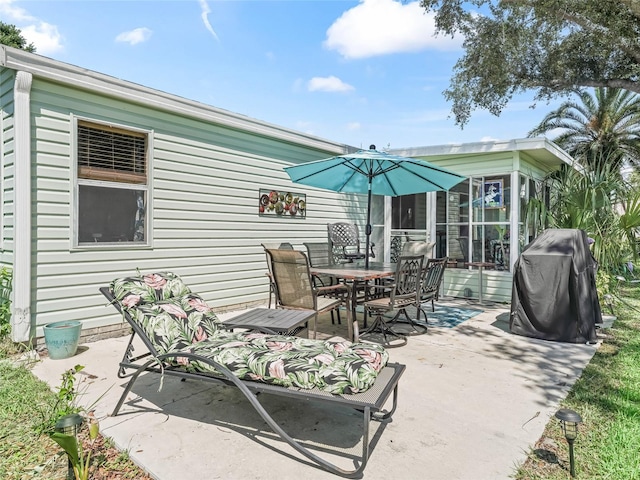 1202 Del Toro Dr, Lady Lake, FL 32159 - view of patio / terrace with outdoor dining area, area for grilling, and a sunroom