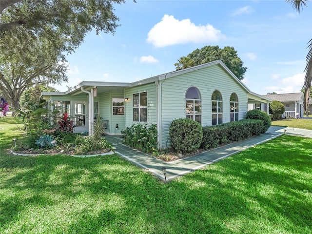 1202 Del Toro Dr, Lady Lake, FL 32159 - view of front of property with a front yard