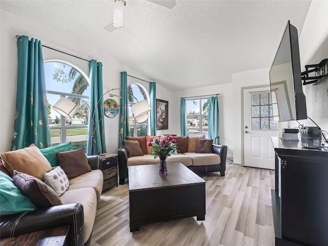 1202 Del Toro Dr, Lady Lake, FL 32159 - living area featuring a textured ceiling, light wood-style flooring, and ceiling fan