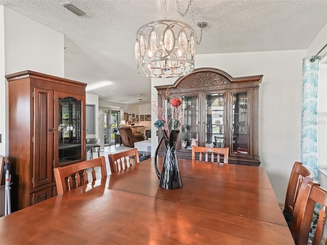 1202 Del Toro Dr, Lady Lake, FL 32159 - dining space featuring a chandelier and a textured ceiling