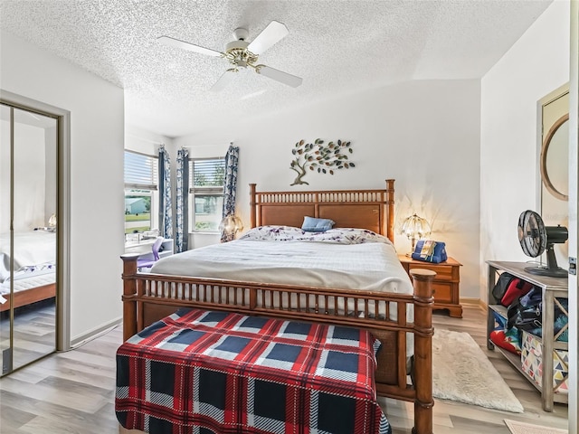 1202 Del Toro Dr, Lady Lake, FL 32159 - bedroom featuring wood finished floors, a textured ceiling, ceiling fan, and baseboards