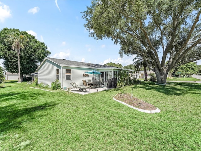 1202 Del Toro Dr, Lady Lake, FL 32159 - back of property with a patio and a yard