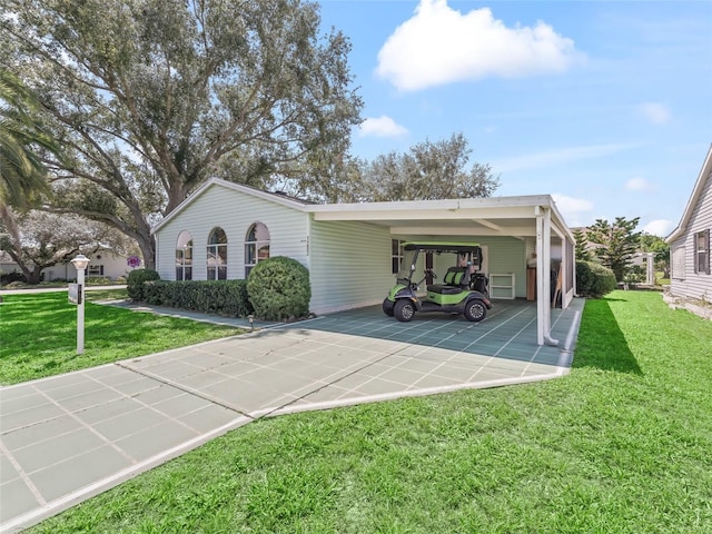 1202 Del Toro Dr, Lady Lake, FL 32159 - view of front of property with a front yard, driveway, and a carport