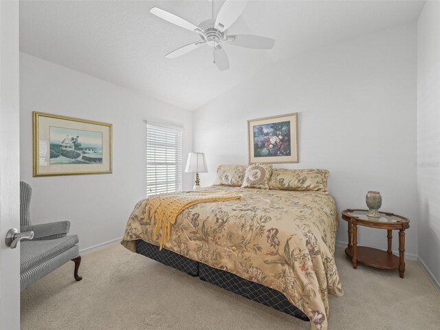 1642 Pennecamp Dr, The Villages, FL 32162 - bedroom featuring carpet floors, vaulted ceiling, baseboards, and ceiling fan