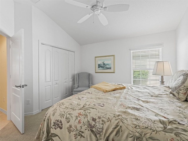 1642 Pennecamp Dr, The Villages, FL 32162 - bedroom with light colored carpet, a closet, vaulted ceiling, ceiling fan, and baseboards