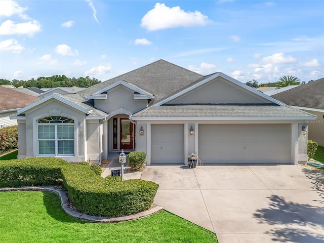 1642 Pennecamp Dr, The Villages, FL 32162 - ranch-style home with stucco siding, concrete driveway, a garage, and a shingled roof