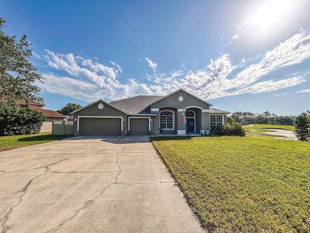 33818 Venice Ln, Sorrento, FL 32776 - ranch-style home featuring an attached garage, a front yard, concrete driveway, and stucco siding