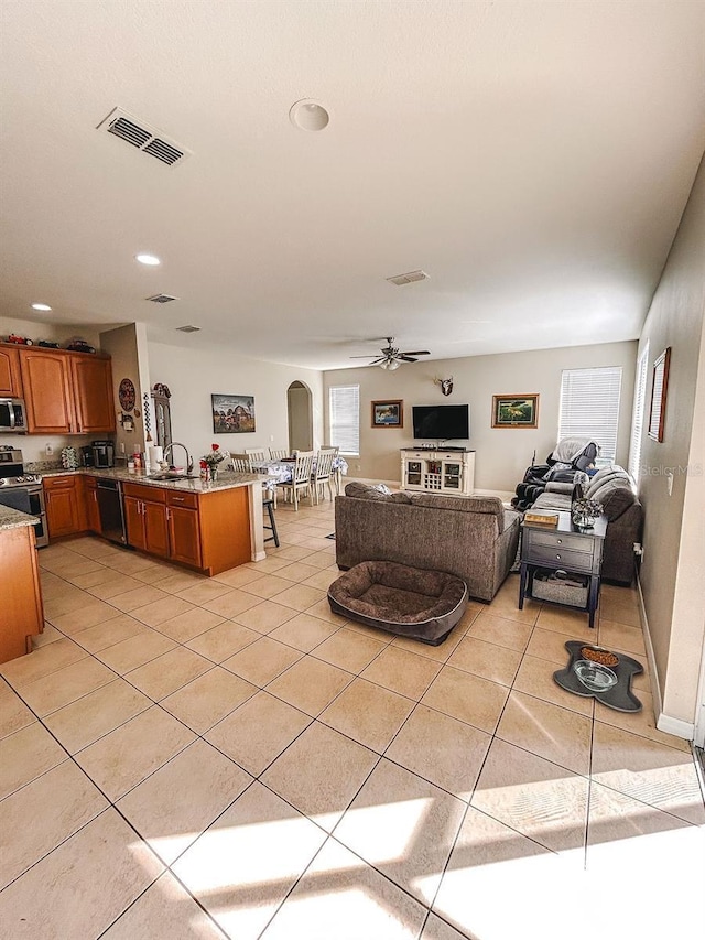 33818 Venice Ln, Sorrento, FL 32776 - living room with ceiling fan, light tile patterned flooring, healthy amount of natural light, and recessed lighting