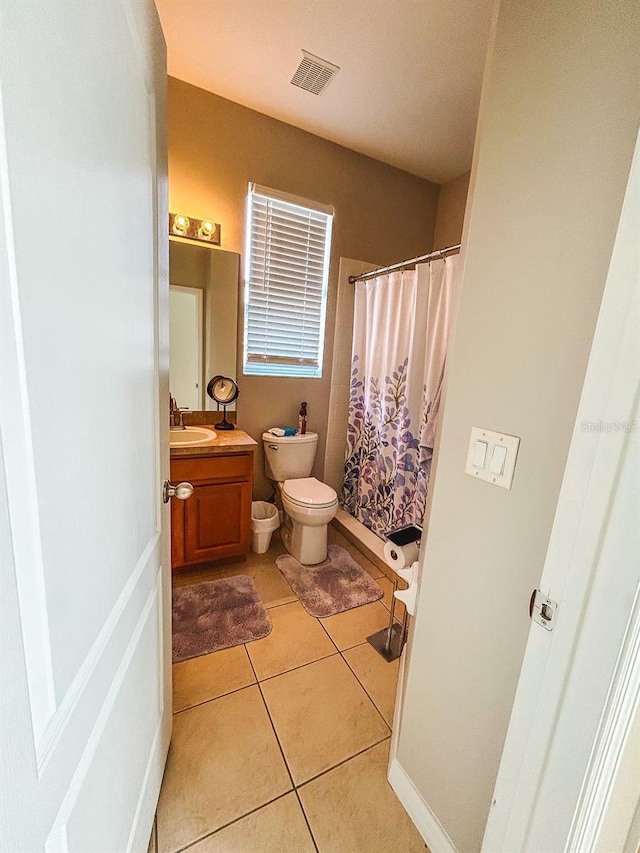33818 Venice Ln, Sorrento, FL 32776 - full bathroom with toilet, vanity, tile patterned flooring, and a shower with curtain