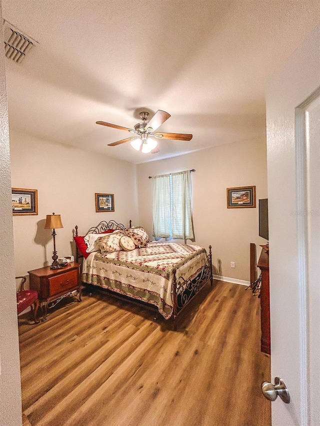 33818 Venice Ln, Sorrento, FL 32776 - bedroom featuring wood finished floors and a ceiling fan