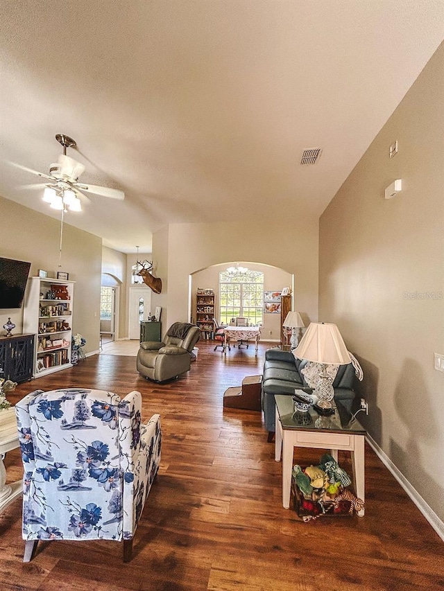 33818 Venice Ln, Sorrento, FL 32776 - living area with wood finished floors, arched walkways, baseboards, and a ceiling fan
